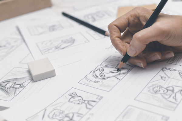 quelqu'un qui dessine une bd