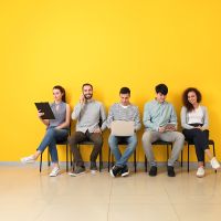 Young people waiting for job interview indoors